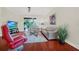 Bright living room with hardwood floors, comfy seating, and a view to backyard at 310 La Creek Ct, Debary, FL 32713
