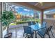 Screened patio overlooking a lake with seating for six at 310 La Creek Ct, Debary, FL 32713