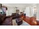 Cozy sitting room with leather furniture and hardwood floors at 310 La Creek Ct, Debary, FL 32713