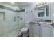 Updated bathroom with granite countertop and a glass-enclosed shower at 325 N Causeway # C301, New Smyrna Beach, FL 32169