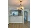 Dining area with decorative pendant lighting adjacent to the bright and functional kitchen at 334 Scottsdale Sq # 334, Winter Park, FL 32792