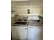 Convenient laundry room with side-by-side washer and dryer at 334 Scottsdale Sq # 334, Winter Park, FL 32792