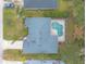 Aerial view of a house and pool, highlighting the property's backyard oasis at 34 Black Creek Way, Ormond Beach, FL 32174