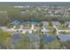 Aerial view of a street lined with houses, showcasing a quiet suburban neighborhood at 34 Black Creek Way, Ormond Beach, FL 32174