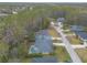 Aerial view of a house with a pool and surrounding neighborhood at 34 Black Creek Way, Ormond Beach, FL 32174
