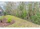 Private backyard with mature trees and meticulously landscaped areas at 34 Black Creek Way, Ormond Beach, FL 32174