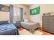 Bedroom with two twin beds, desk, and ample closet space at 34 Black Creek Way, Ormond Beach, FL 32174