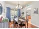 Bright dining room with table for six and access to kitchen at 34 Black Creek Way, Ormond Beach, FL 32174