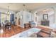 Dining room with hardwood floors, chandelier, and view of kitchen at 34 Black Creek Way, Ormond Beach, FL 32174