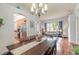 Spacious dining area with hardwood floors and chandelier at 34 Black Creek Way, Ormond Beach, FL 32174