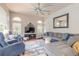 Gathering room with sectional sofa, large TV, and hardwood floors at 34 Black Creek Way, Ormond Beach, FL 32174