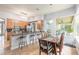 Modern kitchen with light wood cabinets, stainless steel appliances, and an island at 34 Black Creek Way, Ormond Beach, FL 32174