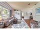 Spacious living room with hardwood floors and large windows at 34 Black Creek Way, Ormond Beach, FL 32174