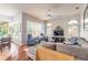 Spacious living room with hardwood floors, comfortable seating, and large windows at 34 Black Creek Way, Ormond Beach, FL 32174