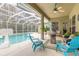 Inviting pool area with screened enclosure and comfortable seating at 34 Black Creek Way, Ormond Beach, FL 32174