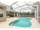 Relaxing kidney-shaped pool with screened enclosure, perfect for outdoor enjoyment at 34 Black Creek Way, Ormond Beach, FL 32174