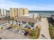 Aerial view showing building, parking and beach location at 3509 S Atlantic Ave # 208, New Smyrna Beach, FL 32169