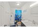 Clean bathroom with shower/tub combo, toilet and vanity at 3509 S Atlantic Ave # 208, New Smyrna Beach, FL 32169