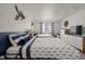 Guest bedroom with nautical decor and two twin beds at 3509 S Atlantic Ave # 208, New Smyrna Beach, FL 32169