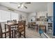 Kitchen and dining area with wooden table and chairs at 3509 S Atlantic Ave # 208, New Smyrna Beach, FL 32169