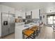 Updated kitchen featuring white cabinets and breakfast bar at 3509 S Atlantic Ave # 208, New Smyrna Beach, FL 32169