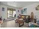 Living area featuring gray couch and ocean view at 3509 S Atlantic Ave # 208, New Smyrna Beach, FL 32169