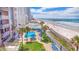Aerial view of condo complex, pool, beach, and pier at 3737 S Atlantic Ave # 502, Daytona Beach, FL 32118