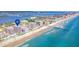 Wide aerial view of coastline, building, and pier at 3737 S Atlantic Ave # 502, Daytona Beach, FL 32118