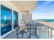 Balcony with chairs overlooking the beach and pier at 3737 S Atlantic Ave # 502, Daytona Beach, FL 32118