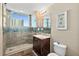 Bathroom with walk-in shower and granite vanity at 3737 S Atlantic Ave # 502, Daytona Beach, FL 32118