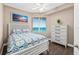 Bright bedroom showcasing a coastal theme, stylish furnishings, and picturesque ocean views at 3737 S Atlantic Ave # 502, Daytona Beach, FL 32118
