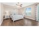 Bedroom featuring a nautical design, wood floors, large window, and plenty of natural light at 3737 S Atlantic Ave # 502, Daytona Beach, FL 32118