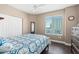 Bedroom features a large window with a view, dark wood floors, and ample closet space at 3737 S Atlantic Ave # 502, Daytona Beach, FL 32118