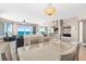 Bright and open floor plan with ocean views visible from the dining area, adjacent to the living room and kitchen at 3737 S Atlantic Ave # 502, Daytona Beach, FL 32118