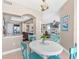 Cozy dining area adjacent to the living room, with views into the kitchen, and a small table and chairs at 3737 S Atlantic Ave # 502, Daytona Beach, FL 32118