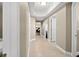 Light beige hallway with tile flooring and access to bedrooms at 3737 S Atlantic Ave # 502, Daytona Beach, FL 32118