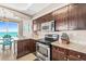 Well-equipped kitchen boasting stainless steel appliances, granite countertops, and beautiful ocean views at 3737 S Atlantic Ave # 502, Daytona Beach, FL 32118