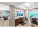Open kitchen with granite counters overlooking the living room, dining area, and ocean views at 3737 S Atlantic Ave # 502, Daytona Beach, FL 32118