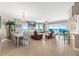 Bright and airy living room with ocean views, tile floors, and comfortable seating at 3737 S Atlantic Ave # 502, Daytona Beach, FL 32118