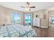 Beautiful bedroom with floor-to-ceiling windows offering ocean views and access to the balcony at 3737 S Atlantic Ave # 502, Daytona Beach, FL 32118