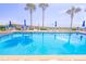 Refreshing blue pool with patio furniture and ocean views at 3737 S Atlantic Ave # 502, Daytona Beach, FL 32118