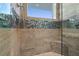 Walk-in shower with glass enclosure and tile accents at 3737 S Atlantic Ave # 502, Daytona Beach, FL 32118