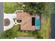 Aerial view of home with pool, spa, and solar panels on the roof at 39 Ormond Green Blvd, Ormond Beach, FL 32174