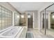 Bathroom featuring a large soaking tub, separate shower, and ample storage space at 39 Ormond Green Blvd, Ormond Beach, FL 32174