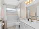 Bathroom with a tub and shower, single sink and toilet at 39 Ormond Green Blvd, Ormond Beach, FL 32174