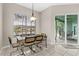 Dining area with a view of the lake from a large window at 39 Ormond Green Blvd, Ormond Beach, FL 32174