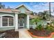 Charming home with a well-manicured lawn, columns, and a welcoming entrance, showcasing curb appeal at 39 Ormond Green Blvd, Ormond Beach, FL 32174