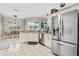 Spacious kitchen featuring stainless steel appliances and a breakfast bar at 39 Ormond Green Blvd, Ormond Beach, FL 32174
