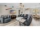 Cozy living room with stylish furniture, wood-look floors, and access to other areas of the home at 39 Ormond Green Blvd, Ormond Beach, FL 32174