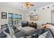 Comfortable living room with wood floors, a view of outdoor living, and sliders to the backyard at 39 Ormond Green Blvd, Ormond Beach, FL 32174
